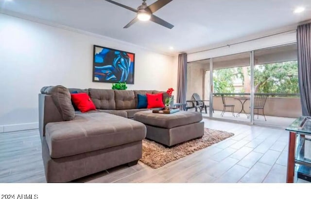 living room with ceiling fan and light hardwood / wood-style floors