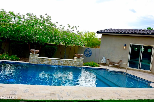 view of pool featuring pool water feature