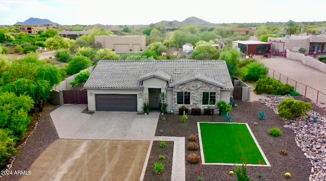 view of front of house featuring a garage and a mountain view