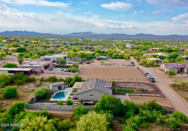 birds eye view of property featuring a mountain view