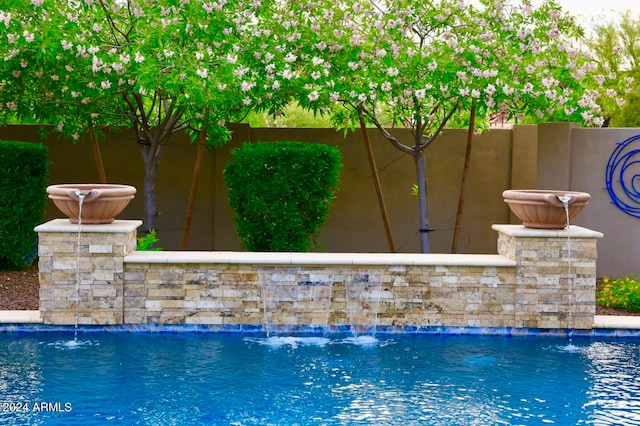 view of pool featuring pool water feature