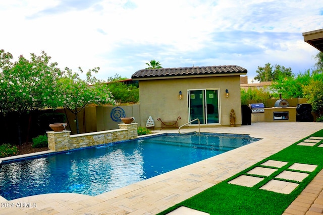 view of pool featuring a patio area, area for grilling, and grilling area