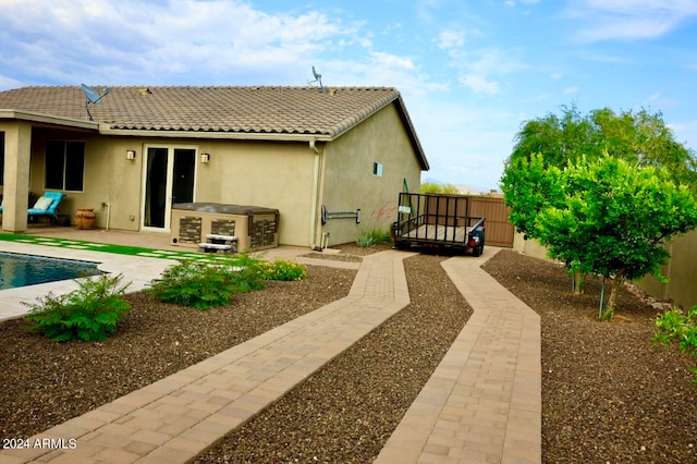 rear view of property featuring a patio area