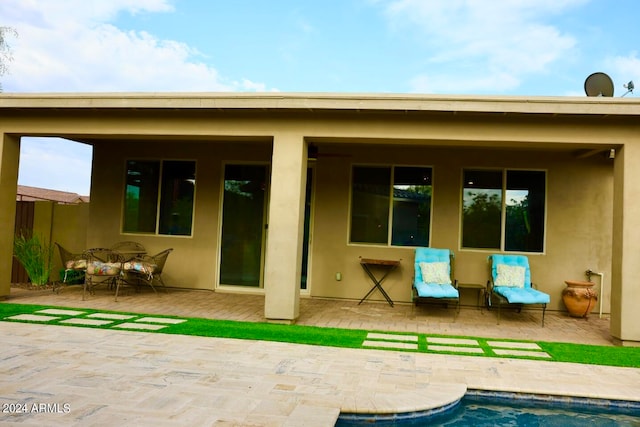 back of house featuring a patio