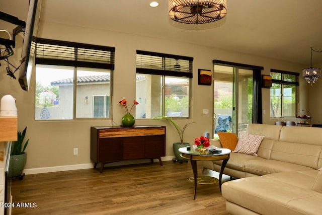 living room featuring a notable chandelier and hardwood / wood-style floors