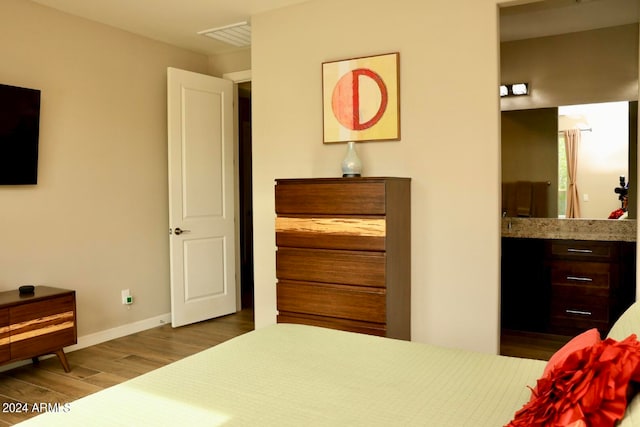 bedroom with dark wood-type flooring