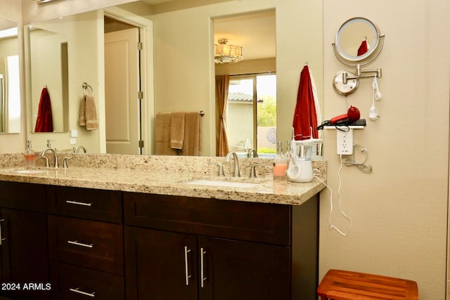 bathroom featuring dual bowl vanity