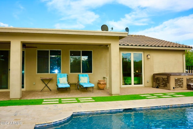 rear view of property featuring a patio area