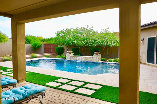 view of swimming pool featuring a patio area