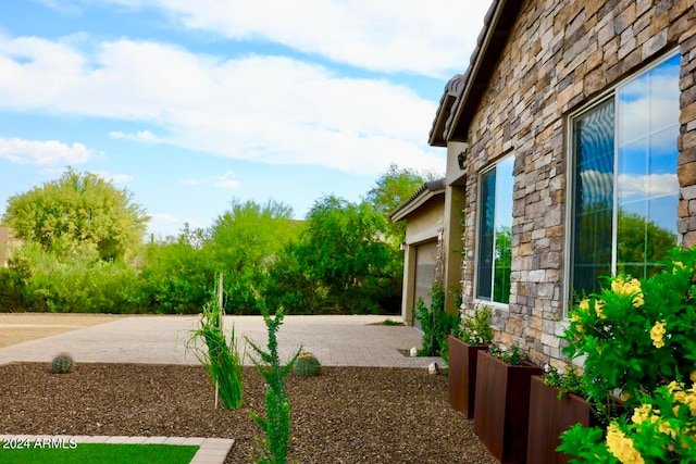 view of yard featuring a garage