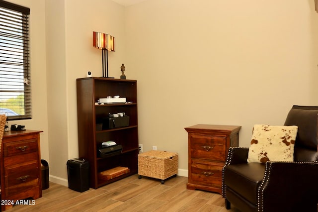 sitting room with hardwood / wood-style flooring