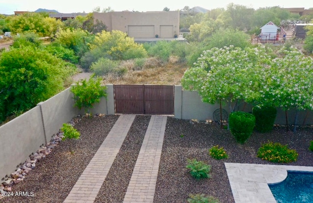 view of yard with a fenced in pool