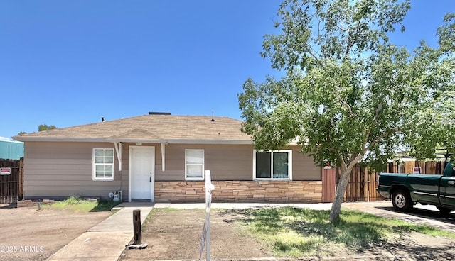 4211 N 32nd Ave, Phoenix, AZ 85017 - view of front of home featuring stone siding and roof with shingles
