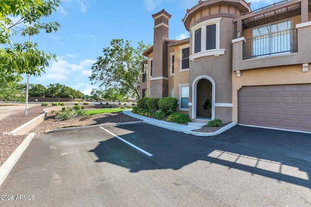 14250 W Wigwam Blvd Unit 2722, Litchfield Park, AZ 85340 - view of building exterior with uncovered parking