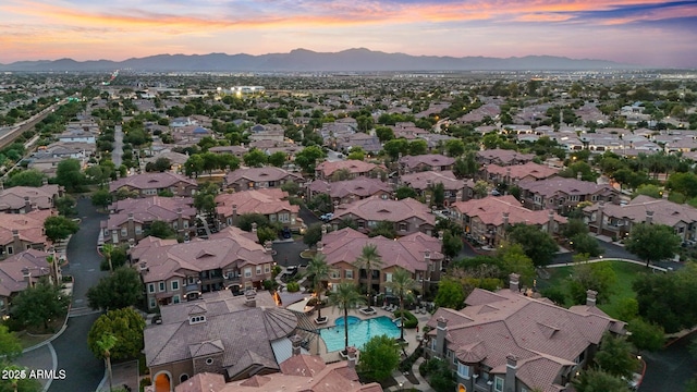 14250 W Wigwam Blvd Unit 2722, Litchfield Park, AZ 85340 - aerial view at dusk of a mountain view, view of pool, and a residential view