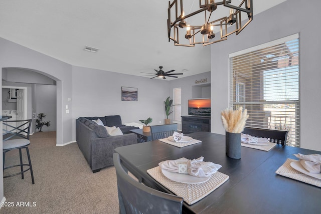 14250 W Wigwam Blvd Unit 2722, Litchfield Park, AZ 85340 - dining area with arched walkways, ceiling fan, and a chandelier