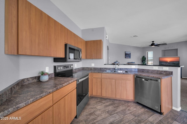 14250 W Wigwam Blvd Unit 2722, Litchfield Park, AZ 85340 - kitchen with appliances with stainless steel finishes, a sink, a peninsula, a ceiling fan, and open floor plan