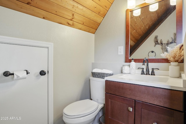 bathroom featuring wood ceiling, vanity, toilet, and vaulted ceiling