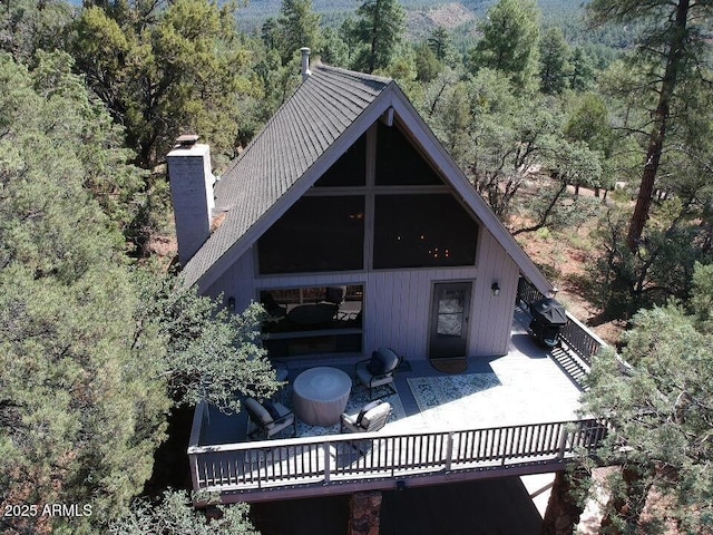 rear view of property with a deck