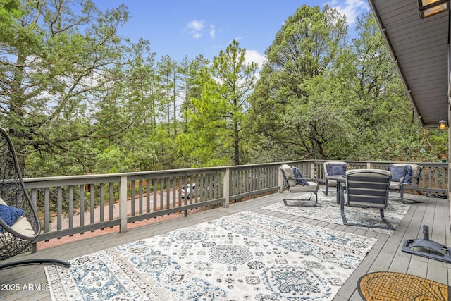 wooden deck featuring an outdoor hangout area