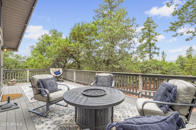 deck featuring an outdoor fire pit