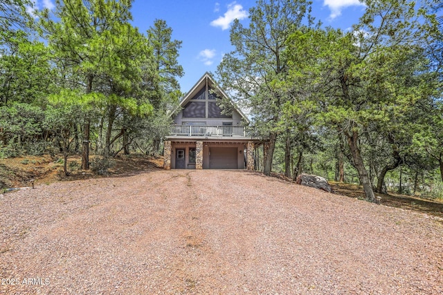 exterior space with a wooden deck and a garage