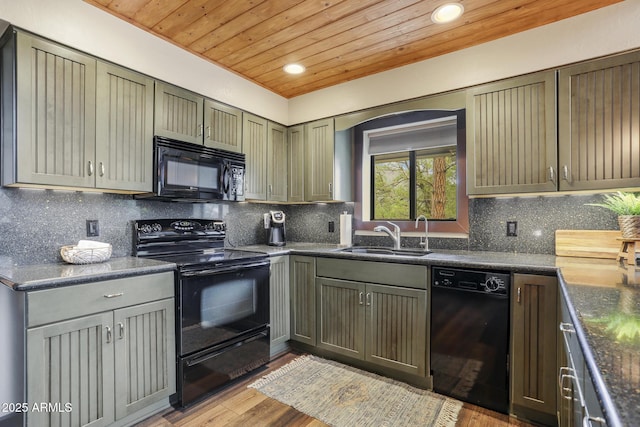 kitchen with sink, backsplash, wood ceiling, black appliances, and light wood-type flooring