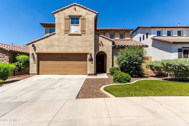 1806 W Fetlock Trl, Phoenix, AZ 85085 - mediterranean / spanish home with a tile roof, stucco siding, a garage, and concrete driveway