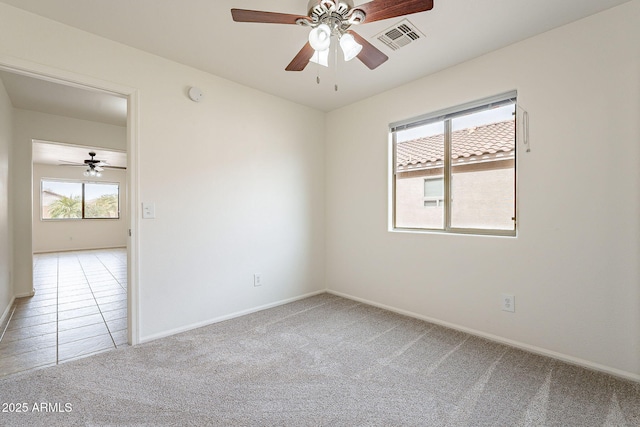 carpeted empty room with ceiling fan