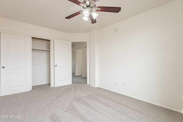 unfurnished bedroom featuring a closet, ceiling fan, and carpet flooring