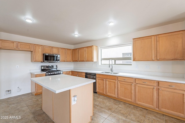 kitchen featuring a kitchen island, sink, and stainless steel appliances