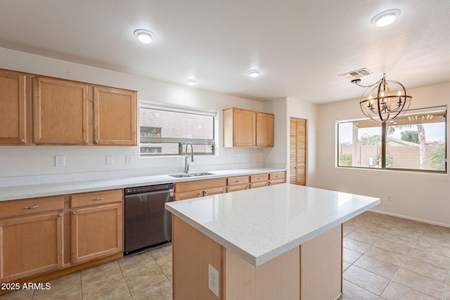 kitchen featuring an inviting chandelier, sink, black dishwasher, a kitchen island, and decorative light fixtures