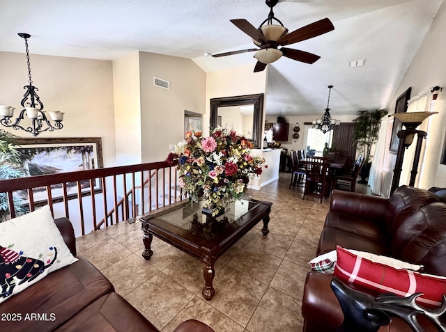 8908 W Sheridan St, Phoenix, AZ 85037 - tiled living area featuring a chandelier, lofted ceiling, and ceiling fan