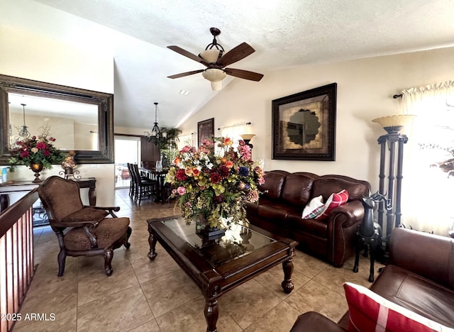 8908 W Sheridan St, Phoenix, AZ 85037 - living area with ceiling fan, vaulted ceiling, tile patterned floors, and a textured ceiling
