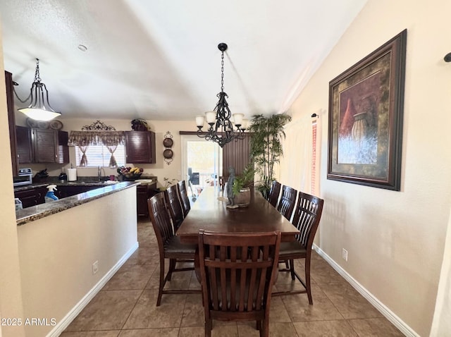 8908 W Sheridan St, Phoenix, AZ 85037 - dining area featuring a chandelier, tile patterned floors, and vaulted ceiling