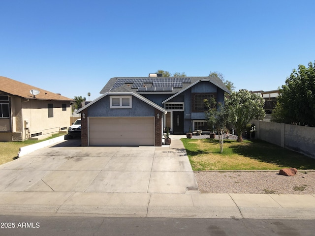 8908 W Sheridan St, Phoenix, AZ 85037 - view of front of home featuring roof mounted solar panels, concrete driveway, stucco siding, and a garage