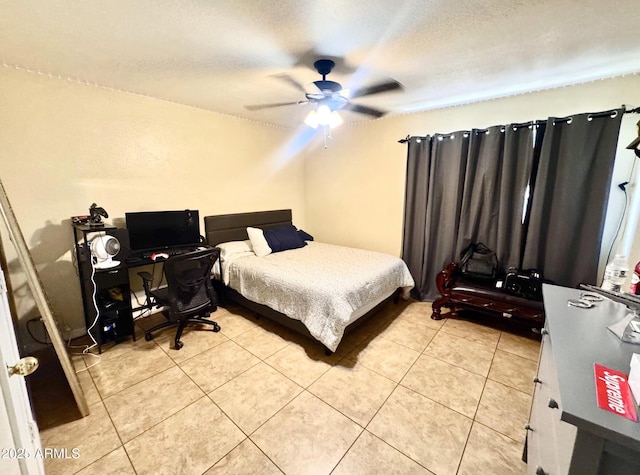 8908 W Sheridan St, Phoenix, AZ 85037 - bedroom featuring light tile patterned floors, a ceiling fan, and a textured ceiling