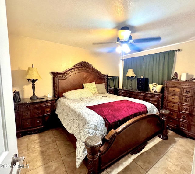 8908 W Sheridan St, Phoenix, AZ 85037 - tiled bedroom featuring ceiling fan and a textured ceiling