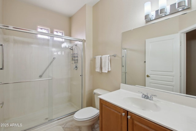 bathroom featuring vanity, toilet, and walk in shower