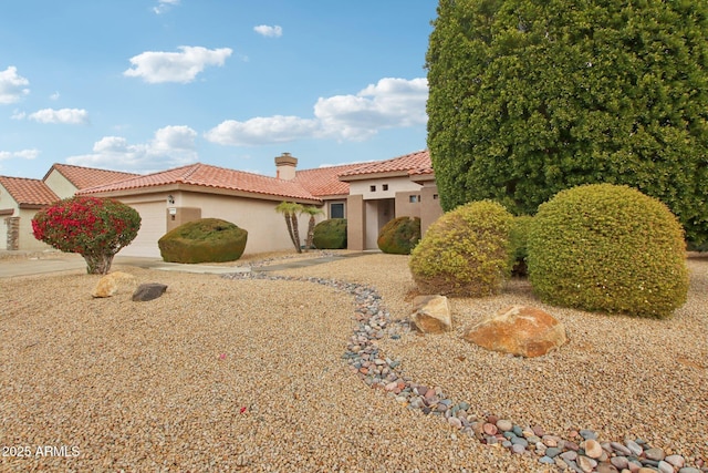 mediterranean / spanish-style house featuring a garage