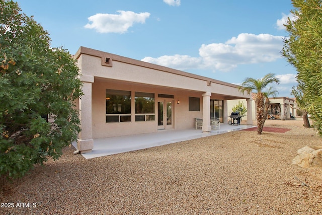 rear view of house with a patio