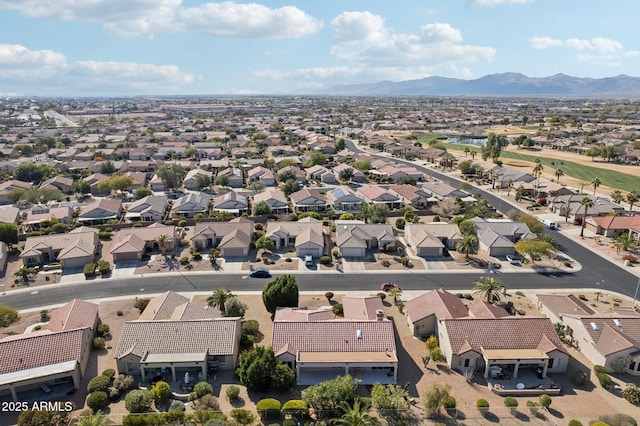 birds eye view of property with a mountain view