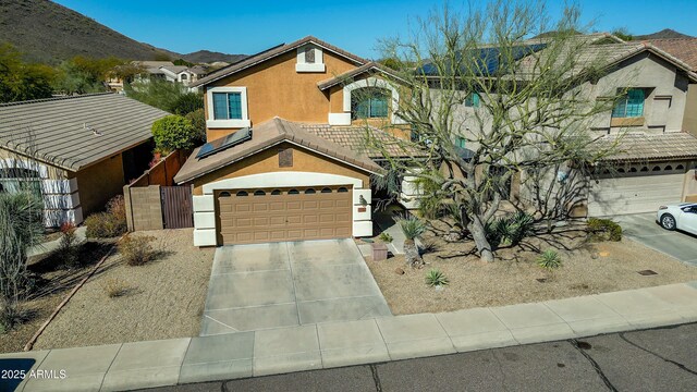 2168 E Vista Bonita Dr, Phoenix, AZ 85024 - view of front of property with concrete driveway, an attached garage, stucco siding, and a mountain view