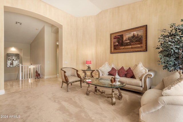 living room with carpet and vaulted ceiling