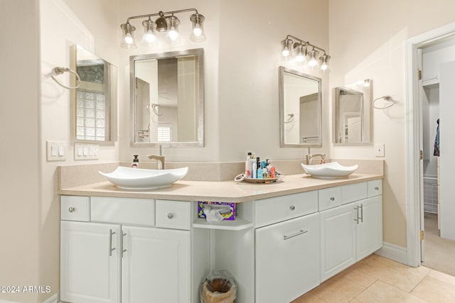 bathroom with tile patterned floors and vanity