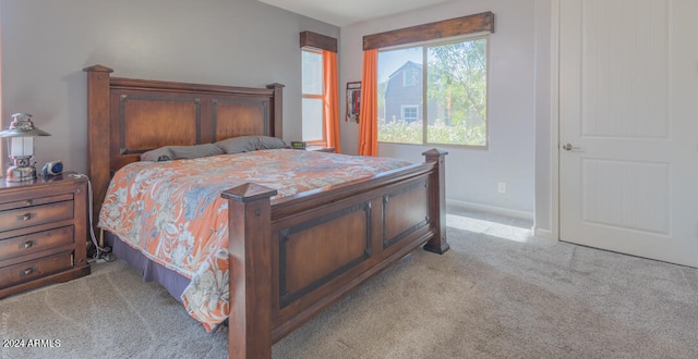 bedroom featuring light colored carpet