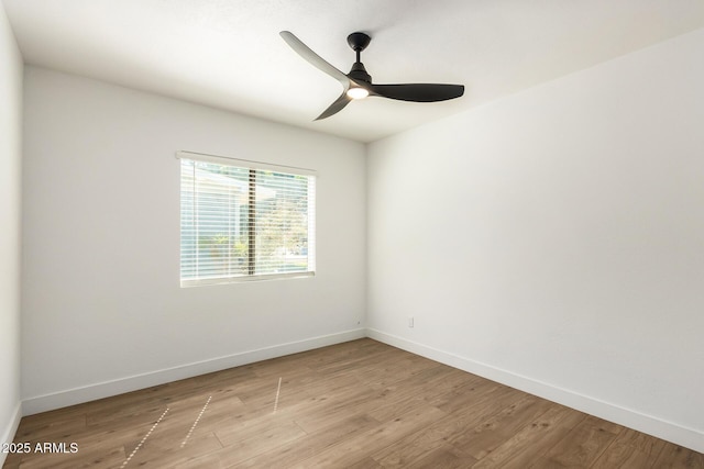 spare room featuring ceiling fan and light hardwood / wood-style floors