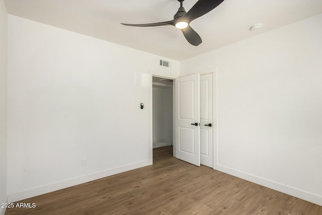 unfurnished room featuring hardwood / wood-style flooring and ceiling fan