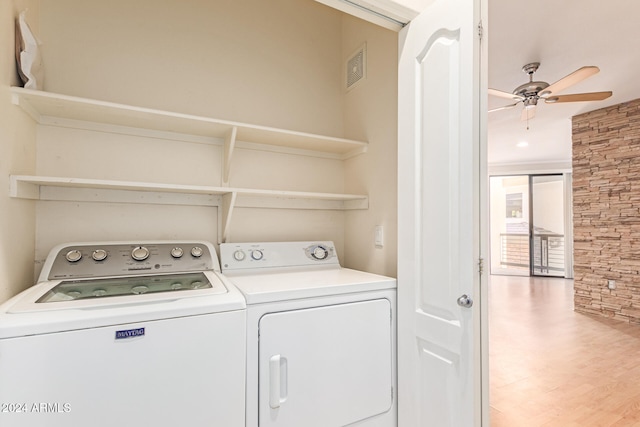 washroom with laundry area, wood finished floors, visible vents, a ceiling fan, and washer and dryer