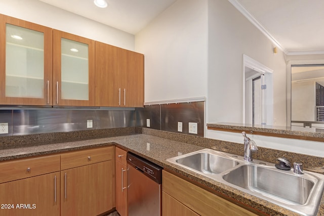 kitchen featuring dishwasher, dark stone counters, ornamental molding, and sink